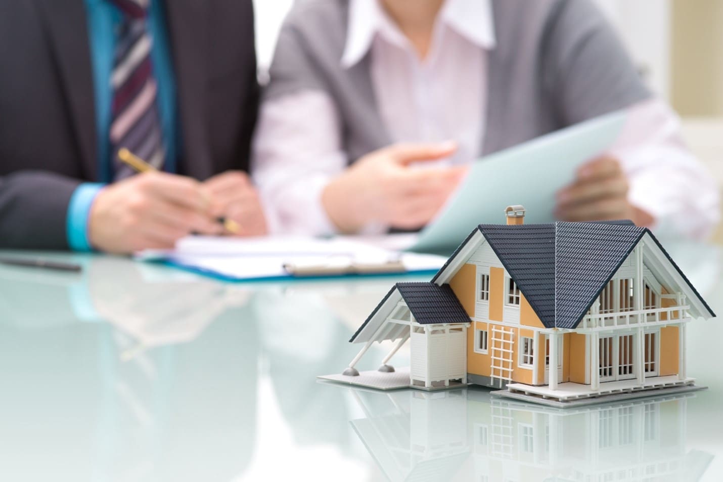 Person considering fractional ownership options with pros and cons list